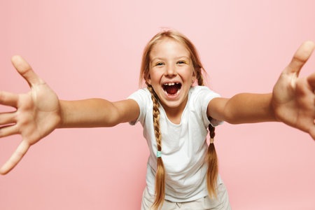 Bursts of Joy: Capturing the Happy Moments of Beautiful Young Girls in their Fun-filled Childhoodの写真素材