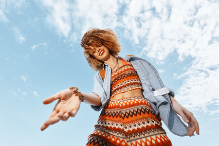 Stylish Caucasian Woman in a Trendy Summer Fashion, Standing Outdoors with a Happy and Relaxed...