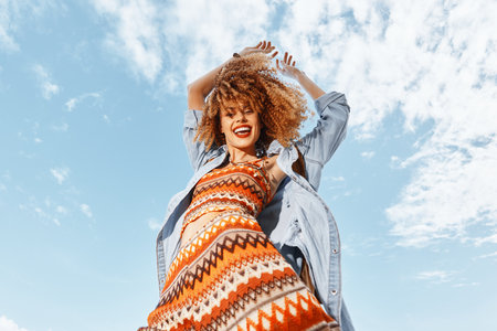 Smiling Beach Woman with Backpack Enjoying a Happy Vacation Dance: Embracing Natures Freedom