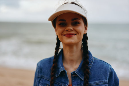 Carefree Summer Beauty: Happy Portrait of a Pretty Young Woman by the Seaの写真素材
