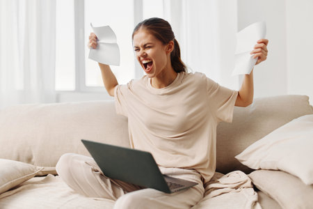 Happiness at Home: Smiling Woman Working on Laptop in Cozy Living Room.