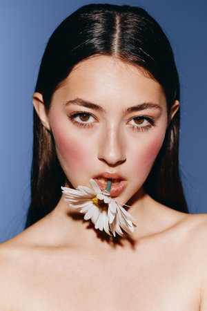 Beauty in Motion: Young Womans Enchanting Portrait, Expressing Confidence and Joy, with a Clean White Backgroundの写真素材