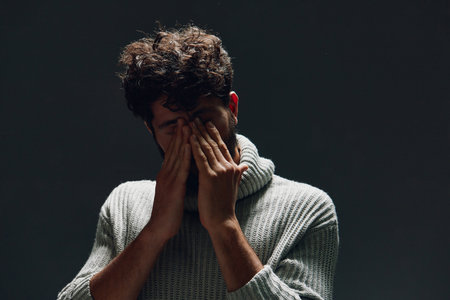 Man young pain person expression adult portrait hand stress depressed unhappy sad