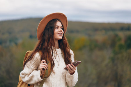 Mountain Woman: Phone-Freedom in Nature.の写真素材
