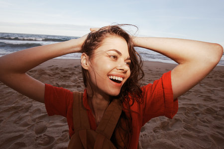 Travel Joy: Woman Backpacker Embracing Nature at Beach, Feeling Free and Relaxed - Wide Angle Summer Adventureの写真素材