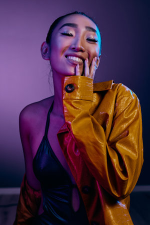 Background woman colorful disco purple light beauty fashionの写真素材