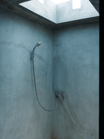 Modern bathroom with skylight shower providing natural light for a refreshing and luxurious shower...
