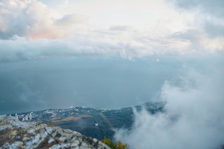 Scenic View from Mountain Top with Clouds in Sky Serene Landscape Shot for Travel and Nature Enthusiastsの写真素材