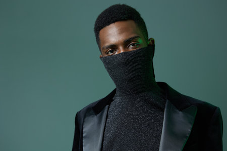 Mysterious man in allblack attire with concealed identityの写真素材