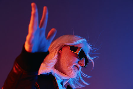 Creative portrait of a stylish individual with long white hair and sunglasses against a vibrant...