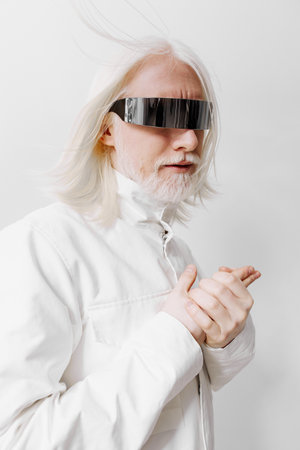 futuristic man with long white hair and sunglasses posing on a light background, showcasing modern...