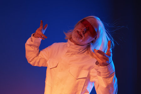 futuristic man with white hair and red sunglasses in a vibrant blue background, posing with a...