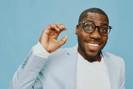smiling man, happy expression, stylish attire, blue background, casual elegance, joyful emotion,...