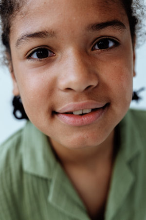 Happy african american boy smiling at the camera with a trendy and confident expressionの写真素材