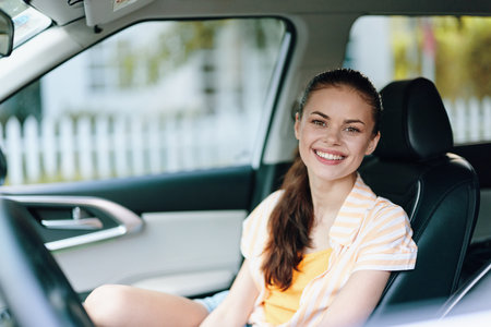 Smiling woman in car, bright interior, casual outfit, enjoying the ride, feeling relaxed and happy...