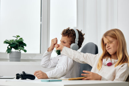 Smiling Boy and Girl Playing Together, Capturing Fun Moments with a Selfie These siblings are enjoying their time indoors, embracing the concept of friendship and connection in the cyberspace era Withの写真素材