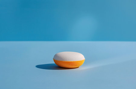 makeup sponge, beauty tool, cosmetics, orange, blue background, everyday makeup, blending, aesthetic photography, beauty inspiration, product photography, minimalism, simplicity, soft texture, cleanの素材