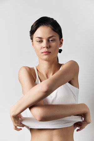 Portrait of a woman with stylish styling effect of wet hair, trendy ponytailの写真素材