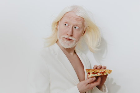 Whimsical portrait of a man with white hair holding a slice of pizza against a plain white...