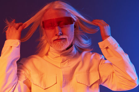 futuristic man with long hair and glasses, vibrant colors, dramatic lighting, modern aesthetic, stylish urban look, artistic portrait, concept of individuality and expression, creative styleの写真素材