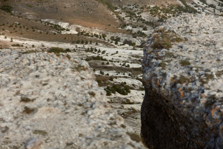 Adventure on a rocky cliff with majestic mountain view in the background