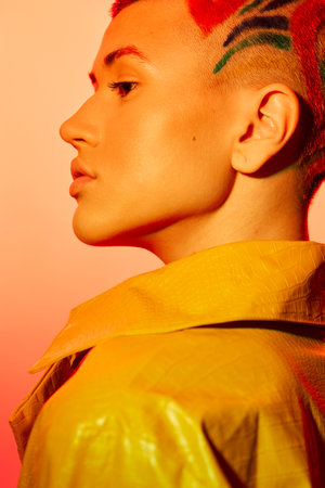 young woman with stylish short hair and colorful shaved patterns wearing a yellow jacket, glowing...