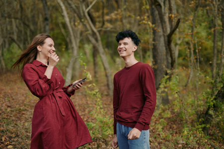 A candid moment conveying authenticity and credibility as two people share a warm exchange in autumn...