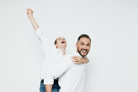 Professional man on a clean isolated white background, presenting a confident, joyful persona with a hint of humor, embodying leadership, ambition, and teamwork in a modern business scene.の写真素材