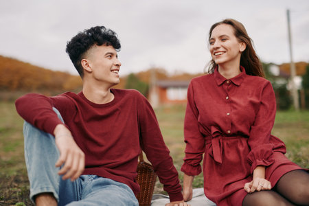 Authenticity and credibility shine in a candid moment between two friends outdoors, relaxed pose, natural expressions, simple scene, everyday trust and connection.の写真素材