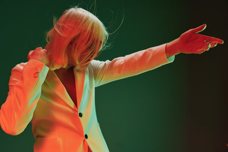 Fashion, model, expressive pose, vibrant colors, art photography, dramatic lighting, contemporary...