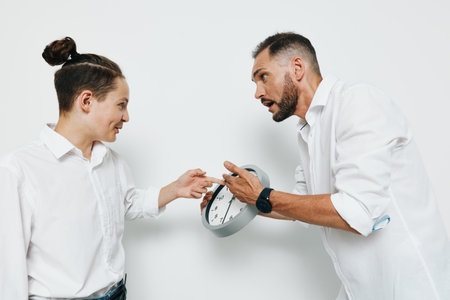 Professional business scene showing a man interacting with a colleague against a plain colored background, highlighting urgency, emotion, and determined focus.の写真素材
