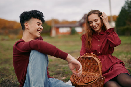 Two friends share a candid outdoor moment, smiling and relaxed, showcasing authenticity and veracity in genuine connection, simple joy, and natural emotion.の写真素材