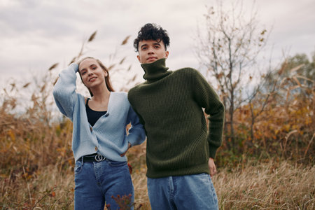 A candid outdoor moment with two friends in autumn light, showing authenticity through relaxed posture, natural textures, and a believable, warm connection.の写真素材