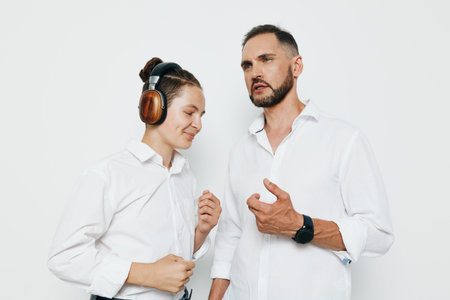 Business professional man with calm, confident demeanor against a clean, solid color background, conveying focus, leadership, and teamwork in a modern workplace.の写真素材