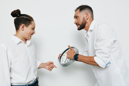 A professional man and colleague share a moment on an isolated color background, showing confident emotion and strong business focus.の写真素材