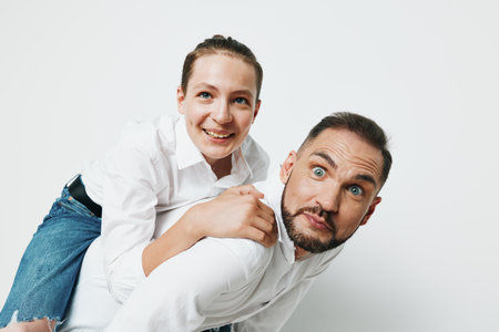 Professional man and colleague in a business setting against a solid color background, showcasing confident posture and positive emotions, ready for teamwork and leadership.の写真素材