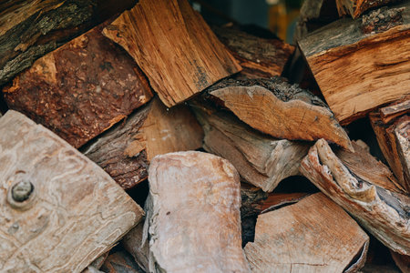 Firewood stacked logs chopped wood wood texture birch logs rustic timber closeup, rough bark and...