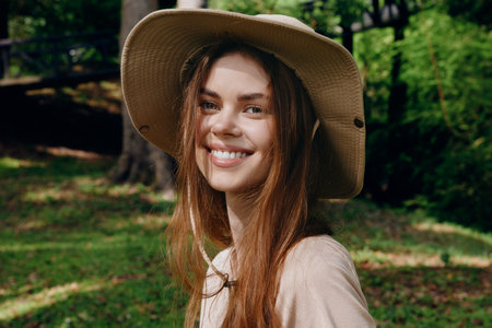 Woman smile hat portrait outdoor nature happy hair, young female wearing sunhat in green park,...
