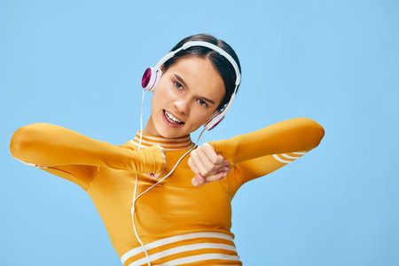 Woman fitness and sport activity in a bright studio, wearing an top and headphones, lively movement...