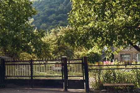 gate garden house trees countryside fence greenery mountain rural floral yard pathway to cottage...