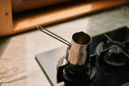 Coffee stove kitchen pot brewing metal authenticity inclusivity closeup of coffee pot on gas range for traditional home brewingの写真素材
