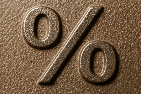 percent symbol on leather material - close up of a metal product surfaceの素材