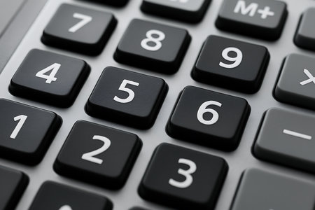Close up of calculator keyboard with numbers, business and finance concept.の素材