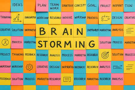 Brainstorming written on colorful sticky notes. Brainstorming conceptの素材