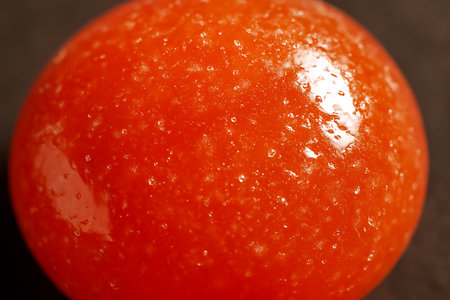 Macro shot of a red round candy. Shallow depth of field.の素材