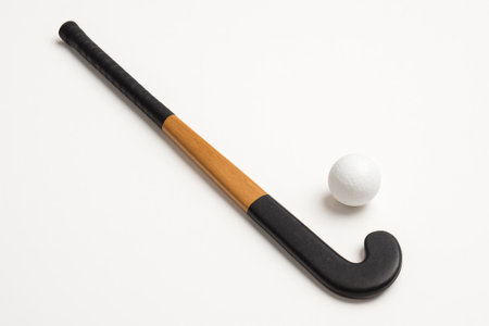 Field Hockey Stick and Ball Isolated â Sports Equipment, White Backgroundの素材