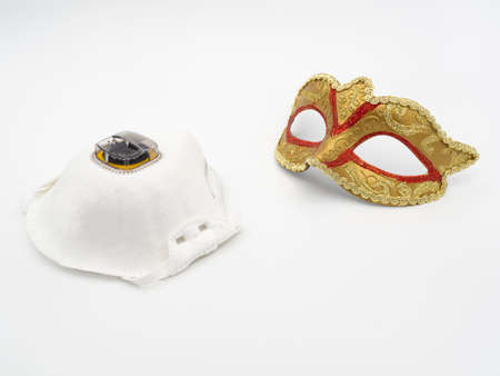 Aerosol white mask and classic carnival mask on a white backgroundの写真素材
