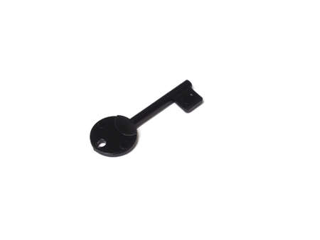 Black plastic key on a white backgroundの写真素材