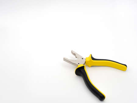 Black and yellow pliers on a white background. The disclosed pliers.