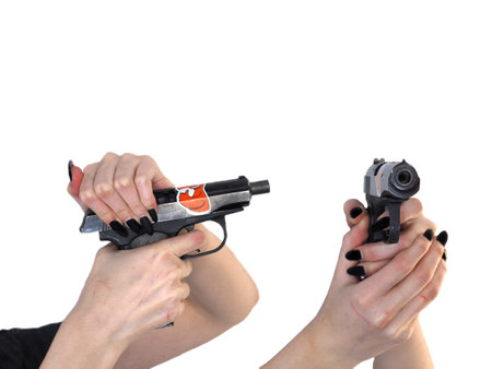 A woman's hand with a gun on white
